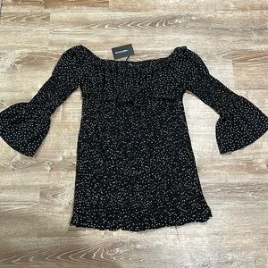 NWT PrettyLittleThing black polkadot dress size 24 with bell sleeves.